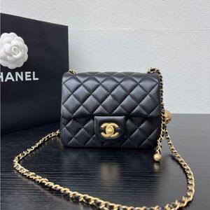 CHANEL Black Quilted Mini Flap with Gold Chain and CC Lock